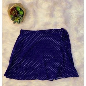 Blue polka dot skirt with tie knot on the side